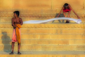 Washermen laying out clothes for drying along the river ghats, Varansi - India