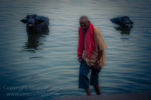 A man emerges from the river after washing his feet, Varanasi - India